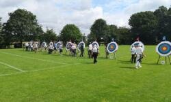 Archers at targets collecting arrows during birthday shoot 2021